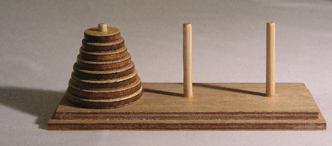 More Interesting Example Towers of Hanoi Move stack of disks from one peg to another