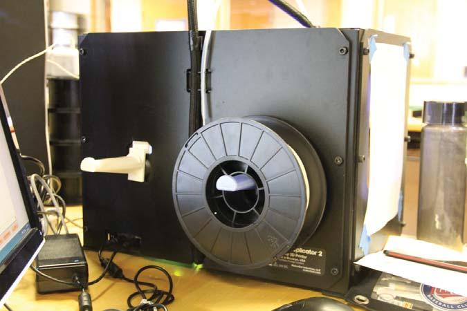 Loading PLA Filament Rear-Mount Spool Holder For The Makerbot 3D Printer.