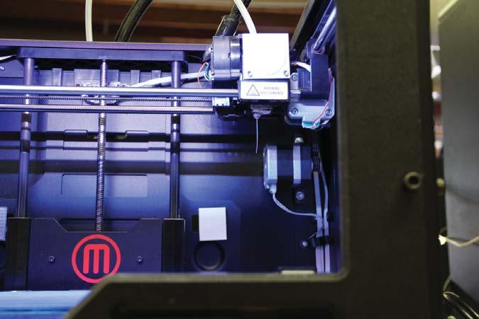 Press the M button to stop extrusion. Wait a few seconds for the extruded PLA to cool, then pull it off the nozzle.