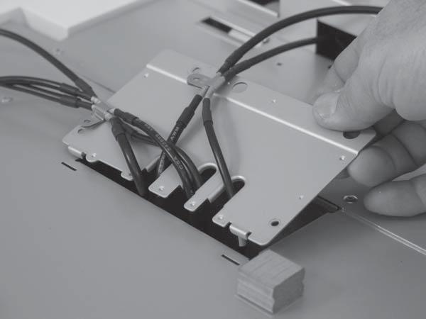 2. Release two tabs and remove the sheet-metal plate. Figure 2-56 Remove the interconnect PCA, fan assembly, and DC connector PCA (2 of 6) 3.