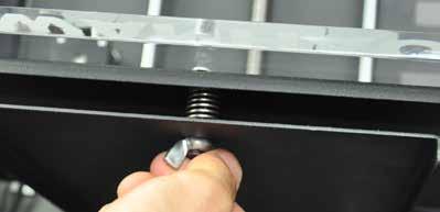 To raise and lower your build plate, look underneath the platform for three separate wingnuts. Adjust only the wingnut underneath your current nozzle position.