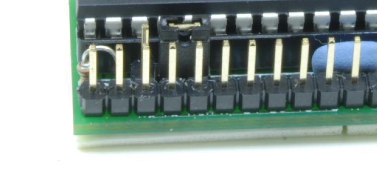 Take the battery clip and attach the ends to a small 2-pin female header as shown in Figure 18. Cut the red lead at about 3.