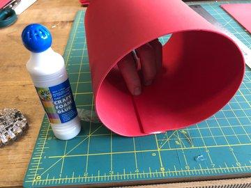 Use tacky craft glue to form an adhesive strip along the edge of