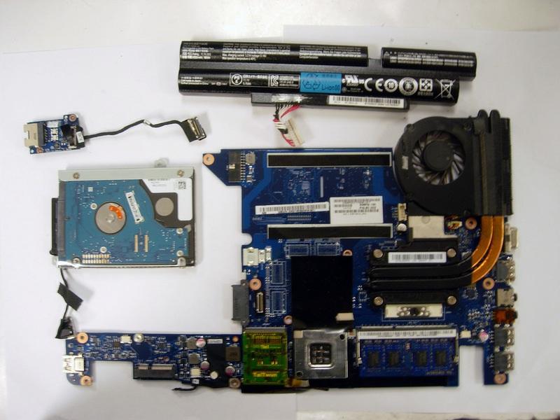 the motherboard in place after the screw has been removed.