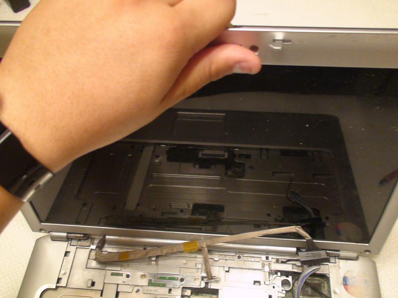 Step 13 There is a risk of dropping the lid or base of the laptop, or damaging cables.