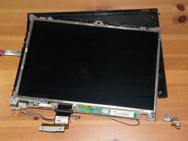 Step 8 Remove the visible screws holding down the LCD panel frame and