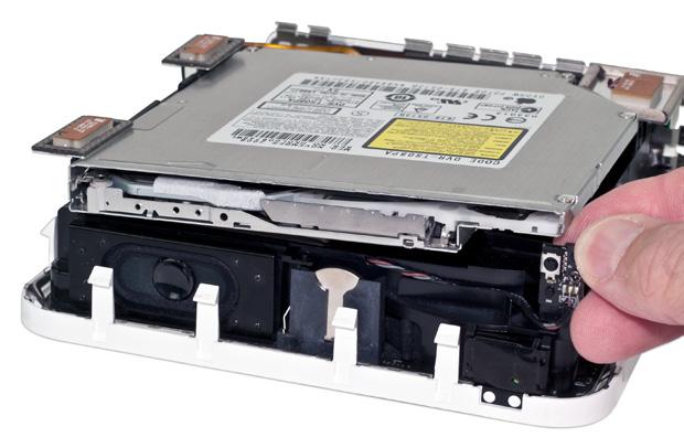 The optical drive is attached to a SATA connector at the rear; if the drive does not come out when you pull, you can disconnect it with a nylon pry tool or your fingernail. 10.