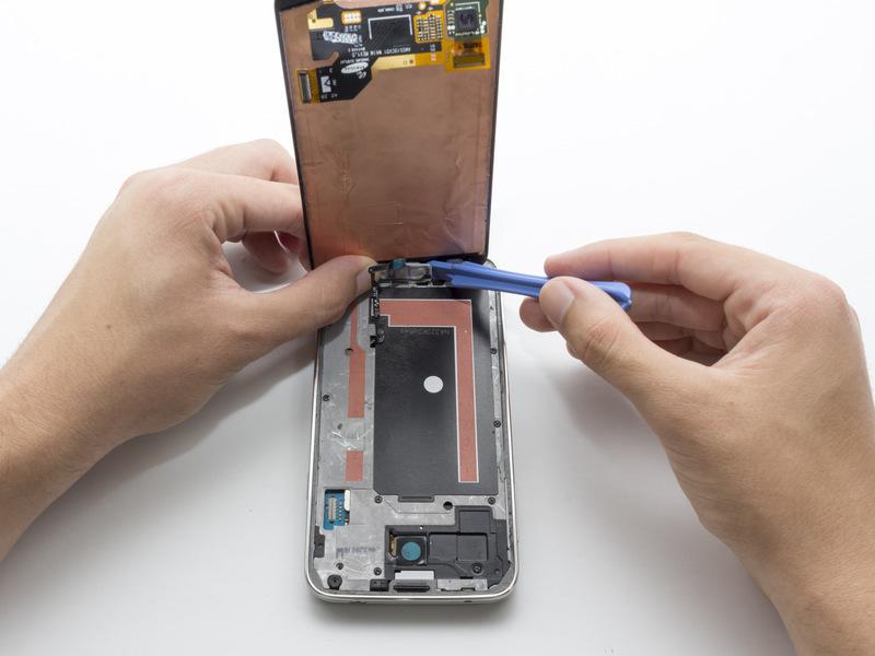 Use the plastic opening tool to pry the home button off.