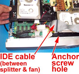 Be sure that the bracket tab is centered under the metal bracket. You can gently move the white cable near the fan toward the power supply to keep it from obstructing airflow under the fan.