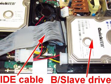 ATTACHING THE CABLES Position (but do not insert) the gray IDE connector directly in front of the B drive, between the drive and the fan.