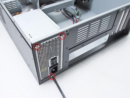Correctly position the PSU at the rear of the chassis with the power switch and cable socket both facing outwards.