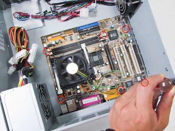 Lay the motherboard to the chassis and secure to the standoff below with the screws provided by the board manufacturer