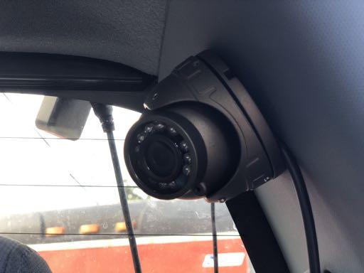 To the right is an example of a mounted camera in the back seat of a Ford F-250.