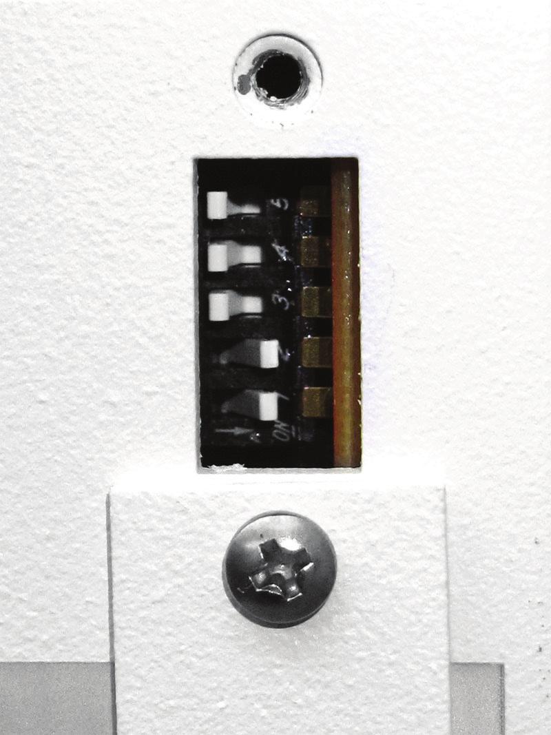 With the power off, set the DIP switches to the Program position.