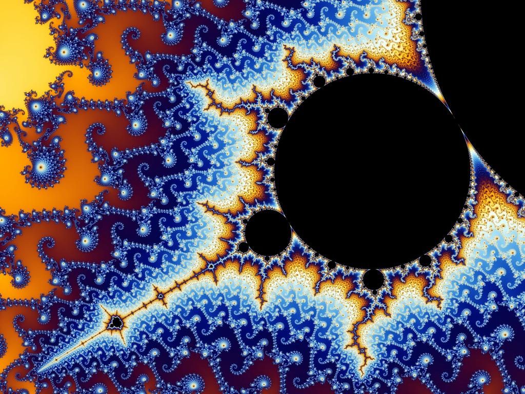 The Mandelbrot set is often graphed with different colors (Figure 4 (b)) used to identify the rate at which certain values outside the set fly off to infinity.