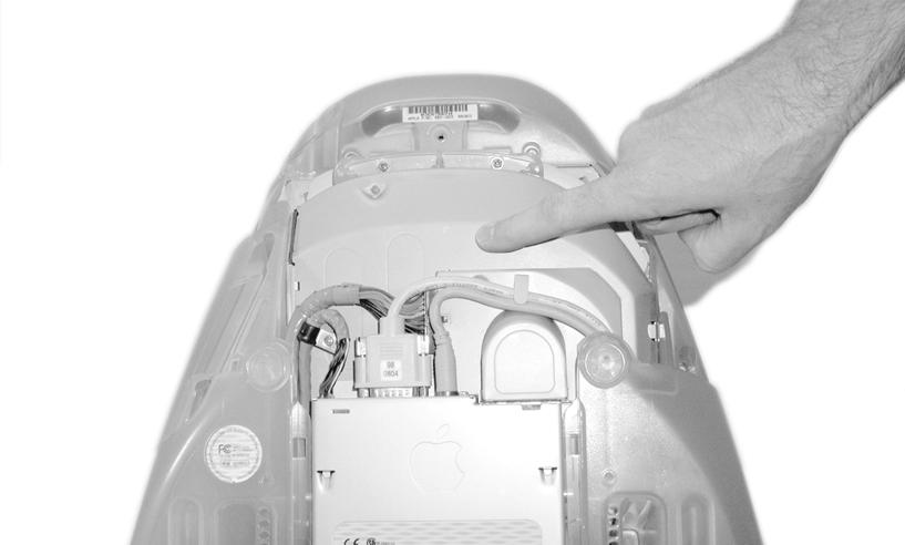 Locate and remove the (#1 Phillips) securing the lower back cover (Figure 2). Using the built-in handle, pull the cover toward you and away from the computer; set the cover and aside.