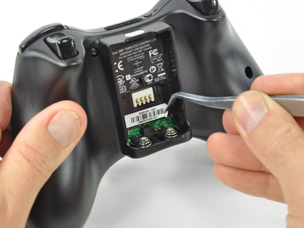 Step 1 Battery Depress the battery release button on the top of the controller. Remove the battery holder from the controller.