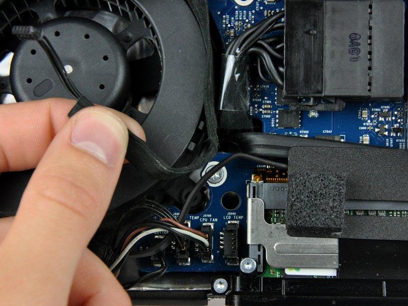 If necessary, de-route the LCD temperature sensor cable from behind the logic board.