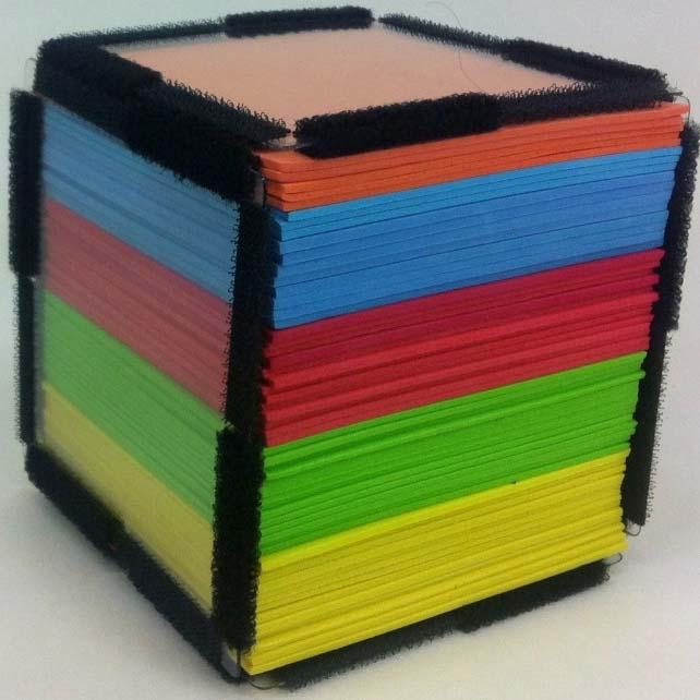 Enclose the stack of approximately 4.3inches (five colors) of foam squares in four Geometro squares. Remove or add a few foam square of the fifth color as needed, so that the cube is full.
