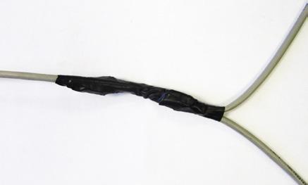 Once all the wires are crimped, carefully twist the wires up. Then fold them back and tape them up with electrical tape to clean up your wiring.
