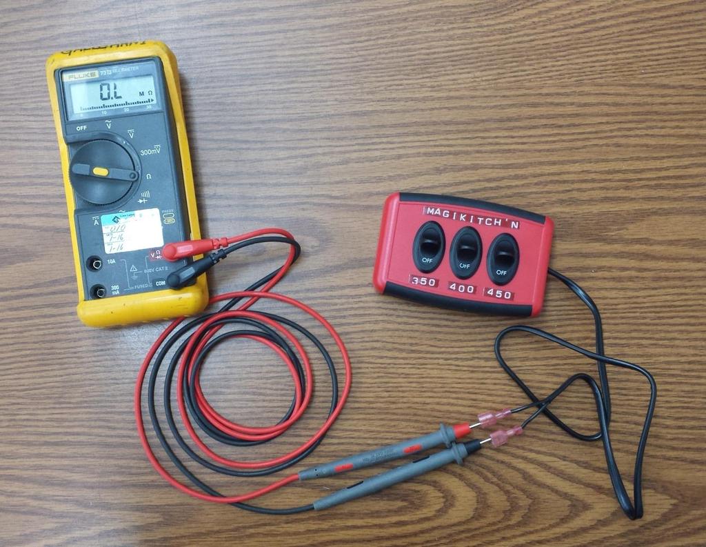 Test Box Calibration/Verification Procedure: Figure 15: To verify the calibration device, connect your multi meter/ohm reader as shown above. 1. Verify that when all switches are in the OFF position that the device reads 0 Ohms (shown above).