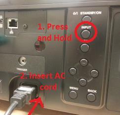 After the AC cord is inserted, keep holding the INPUT button for approximately 5 seconds, then release the INPUT button.