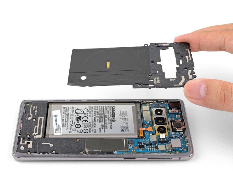 To reinstall the top midframe: Align the midframe's top edge to the phone and lay the frame down on the phone.