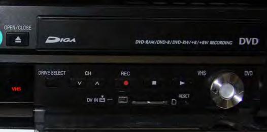 5. Place a blank DVD in the DVD slot. 6. On the remote labeled DVD/VHS, press REC MODE ().