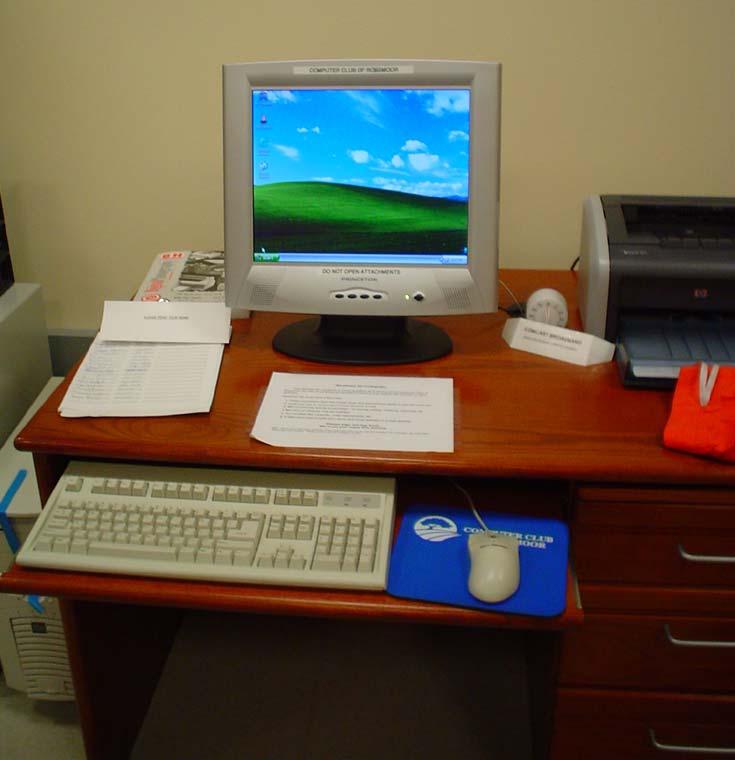 A workstation (public computer shown.) other computer users, and with computer users and the volunteers when help was needed.