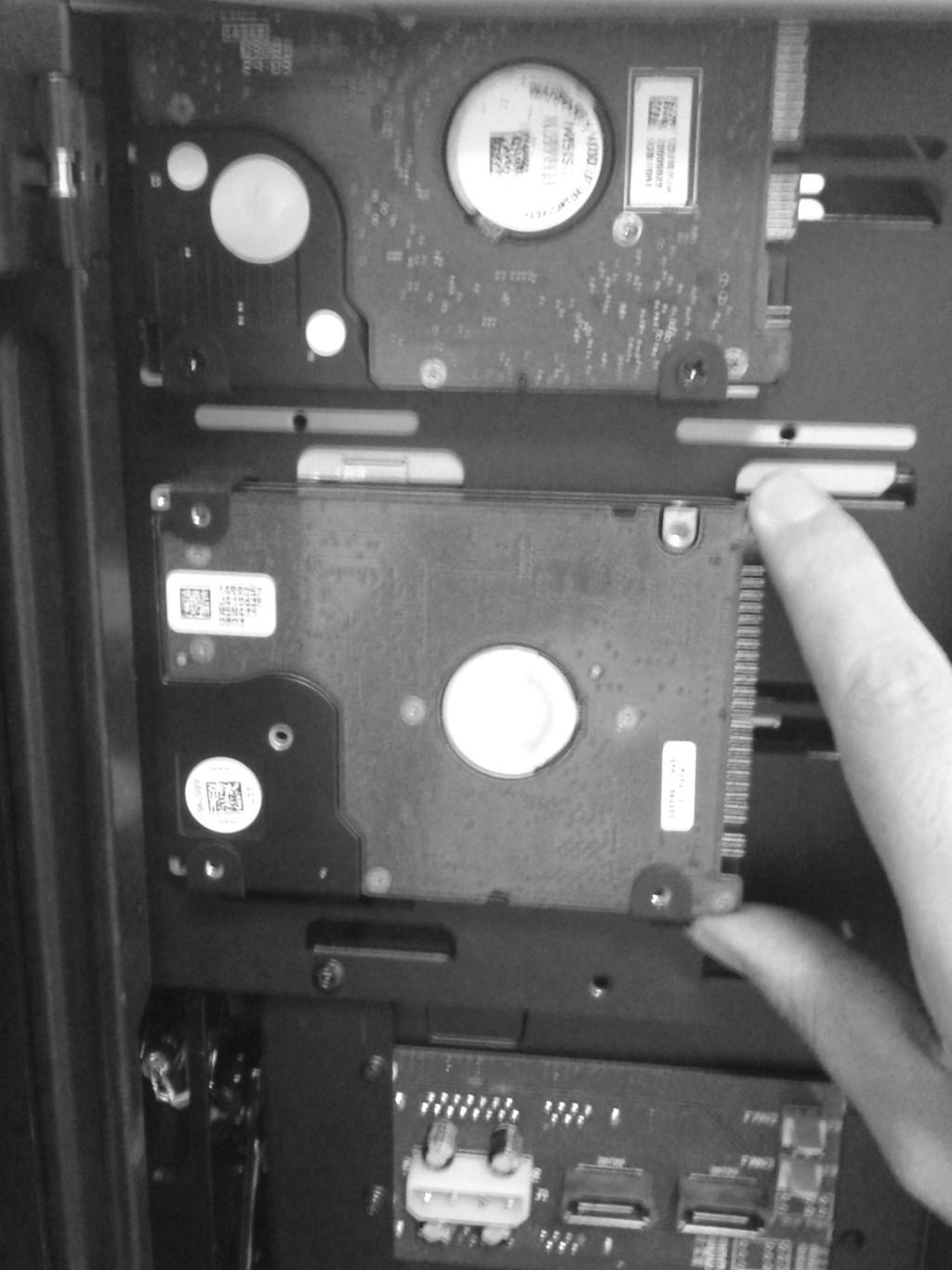 Two HDDs/SSDs on the side of the 5,25 drive cage and