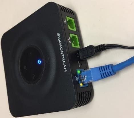2. Use the ethernet cable to connect the blue ethernet LAN port, located on the back of the ATA, to a network.
