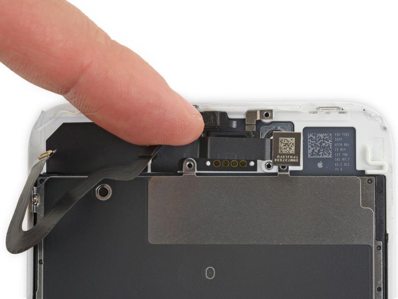 and attached ribbon cable toward the bottom of the iphone to