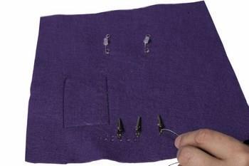 Place the final crocodile clip into position and sew and secure.