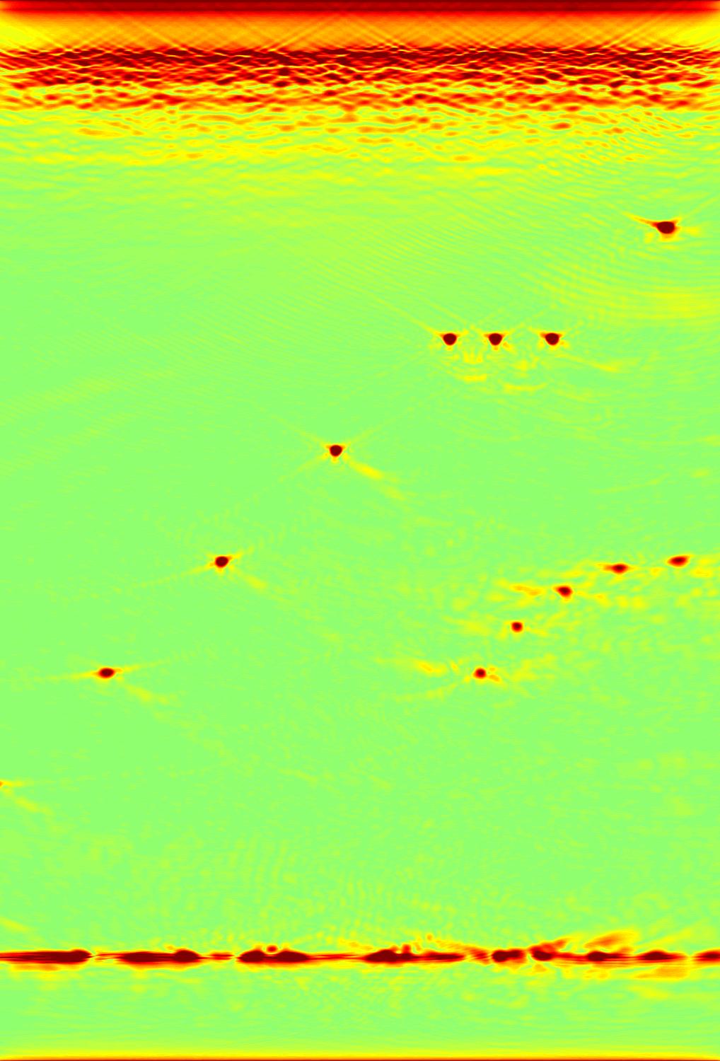 artifacts as it is clearly visible in the area of the holes in half-circle of the image in Figure 3. Moreover, note that migration permits a better near surface imaging.