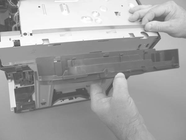 Carefully raise the right side of the product, find the three slots in the chassis (callout