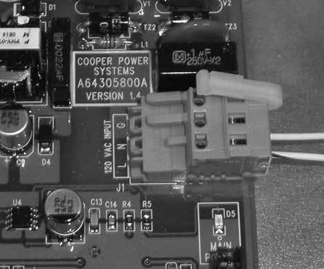 6. Loosen the module mounting screw to the right of the RS-485 connectors (lower right corner).