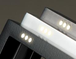 The three white LEDs change color to indicate access permitted or access denied.