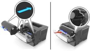 Insert the toner cartridge by aligning the side rails of the cartridge with the arrows on the side rails inside the