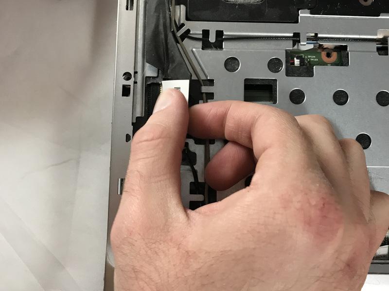 Gently pull the cable connector to