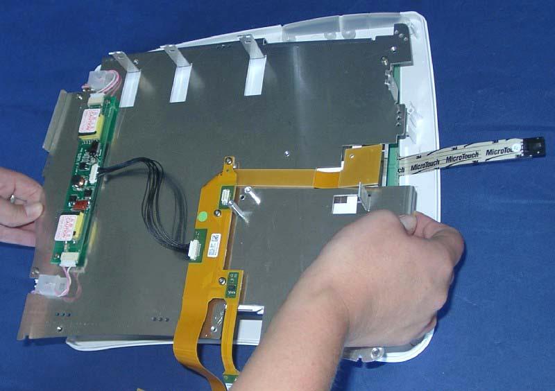 and lift upwards to remove the connector to the display.