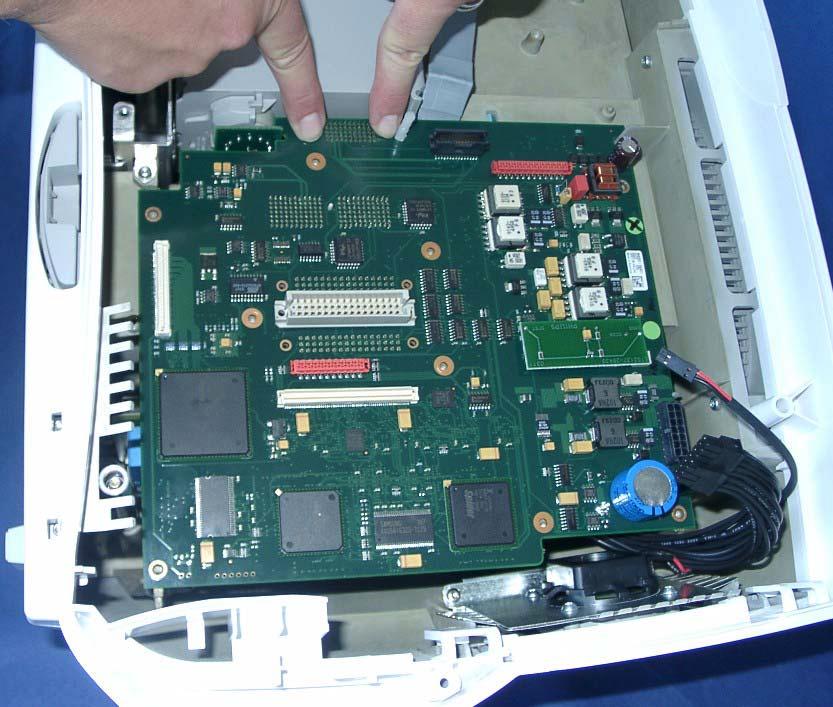 the rear chassis and the slit for the internal module rack board and that the board is connected properly to the rack connector.