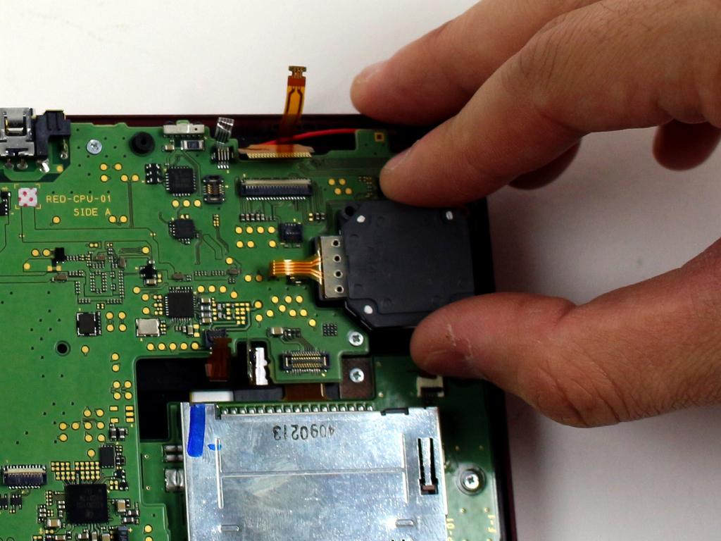 Nintendo 3DS XL 2015 Motherboard Replacement Step 11 Lift the circle pad casing upward to remove it.