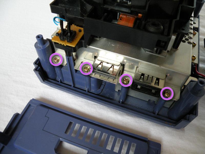 of the twelve (12) screws are located tot eh right of the optical drive unit.