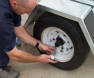 5. Use the chains on the trailer to lock the wheels in place as a preventative