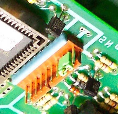 In the close-up image below, the jumper is placed across PIN 2 and PIN 3. Be sure that the crossed pins are as pictured below to prevent circuitry damage when the unit is powered on.