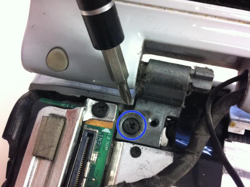 Next, remove the 2 screws securing the LCD hinge