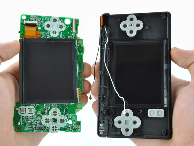 Pull the motherboard away from the DS Lite to separate the upper LCD ribbon cable from its socket on the motherboard.