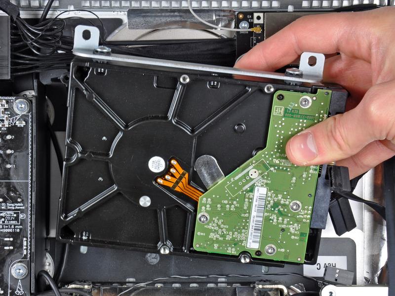 case. Lift the hard drive off its two lower positioning