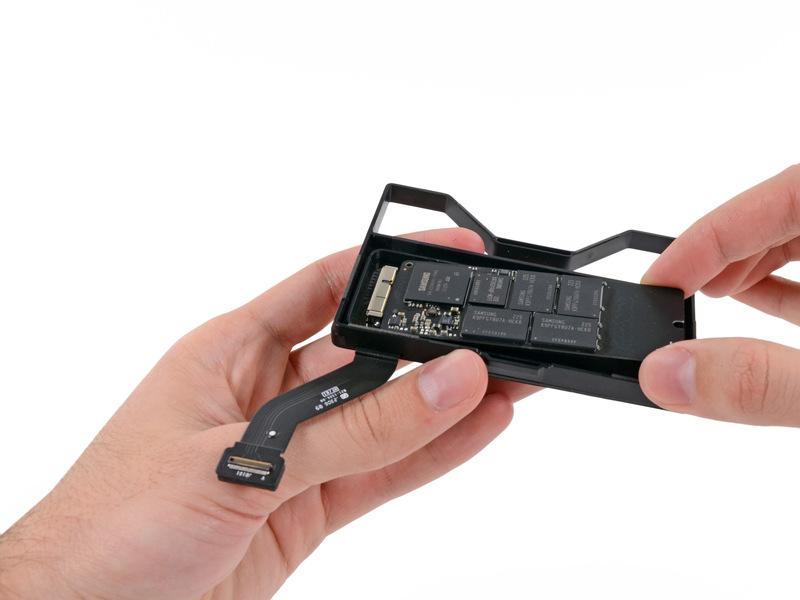 Step 15 Carefully pull the SSD straight out of its socket on the SSD tray. Step 16 SSD SSD remains.