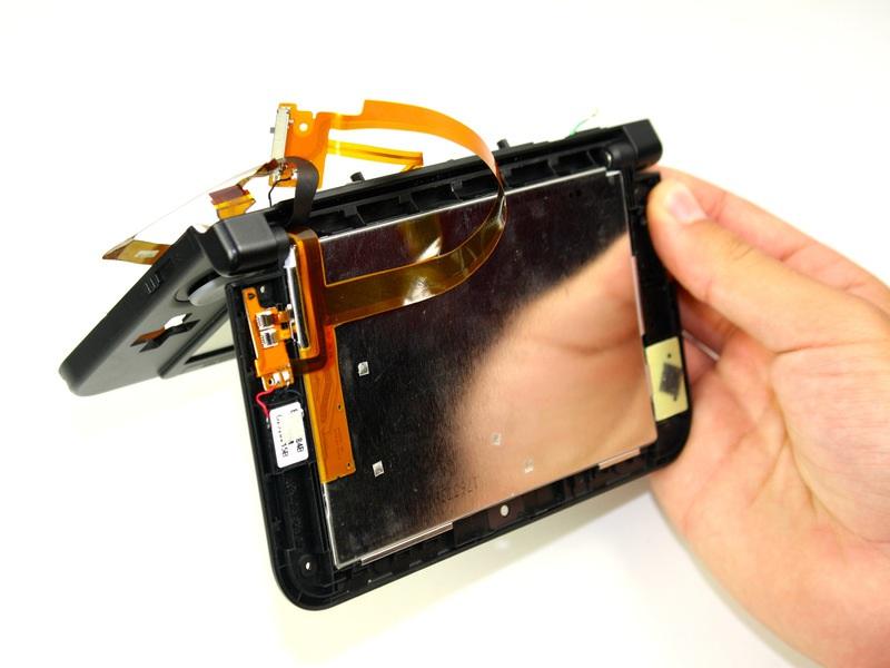 Step 29 Open the hinge and carefully pop off the Upper LCD using your fingers. Gently remove the ribbon from the hinge.